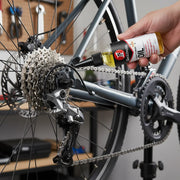 Chain scrubber clipped under a bike chain