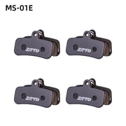 ZTTO Semi-Metallic Disc Brake Pads — pad next to a coin for size reference